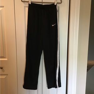 Boys Nike black sweatpants with white stripe down the leg